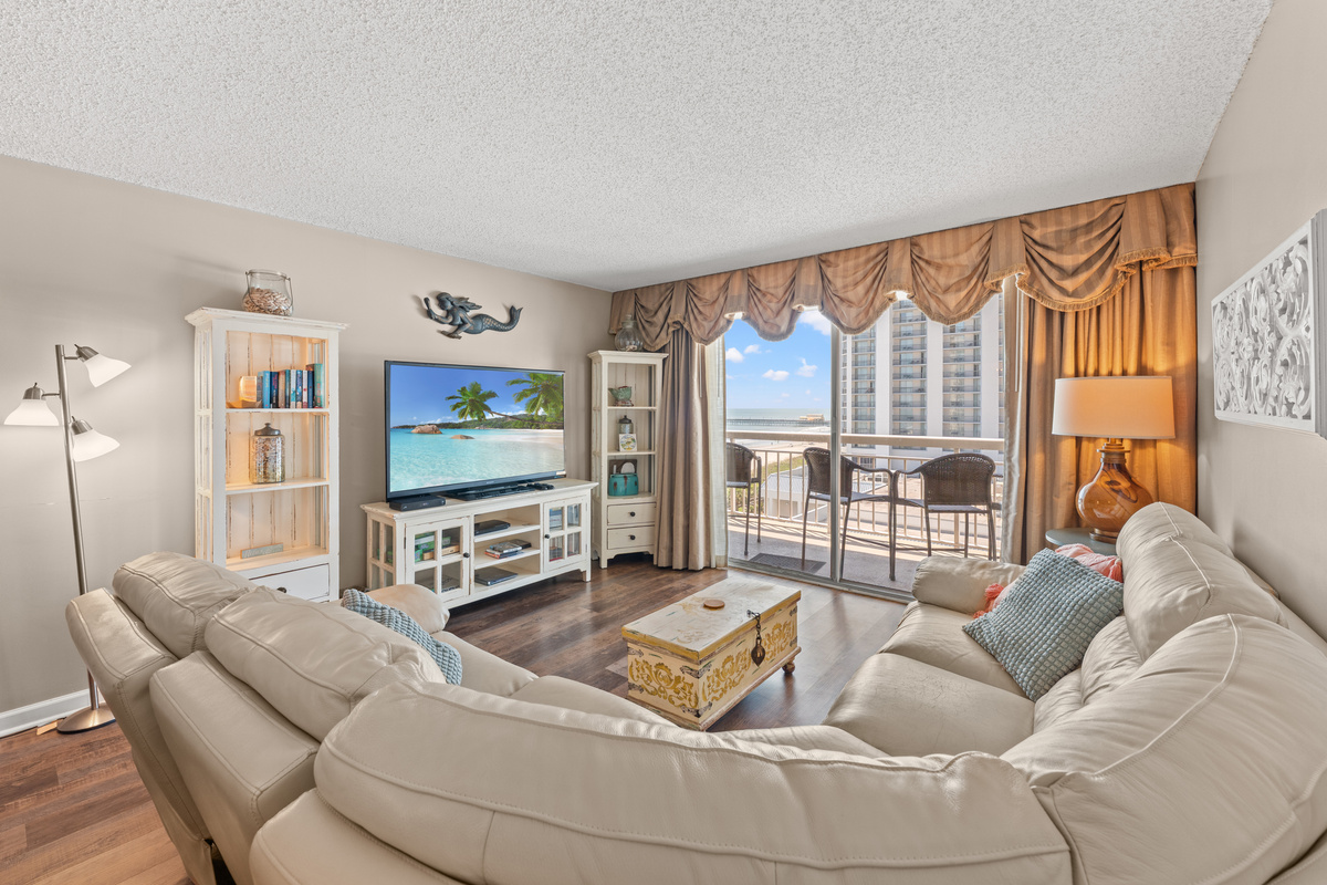 Huge Living Room with large TV and balcony access 