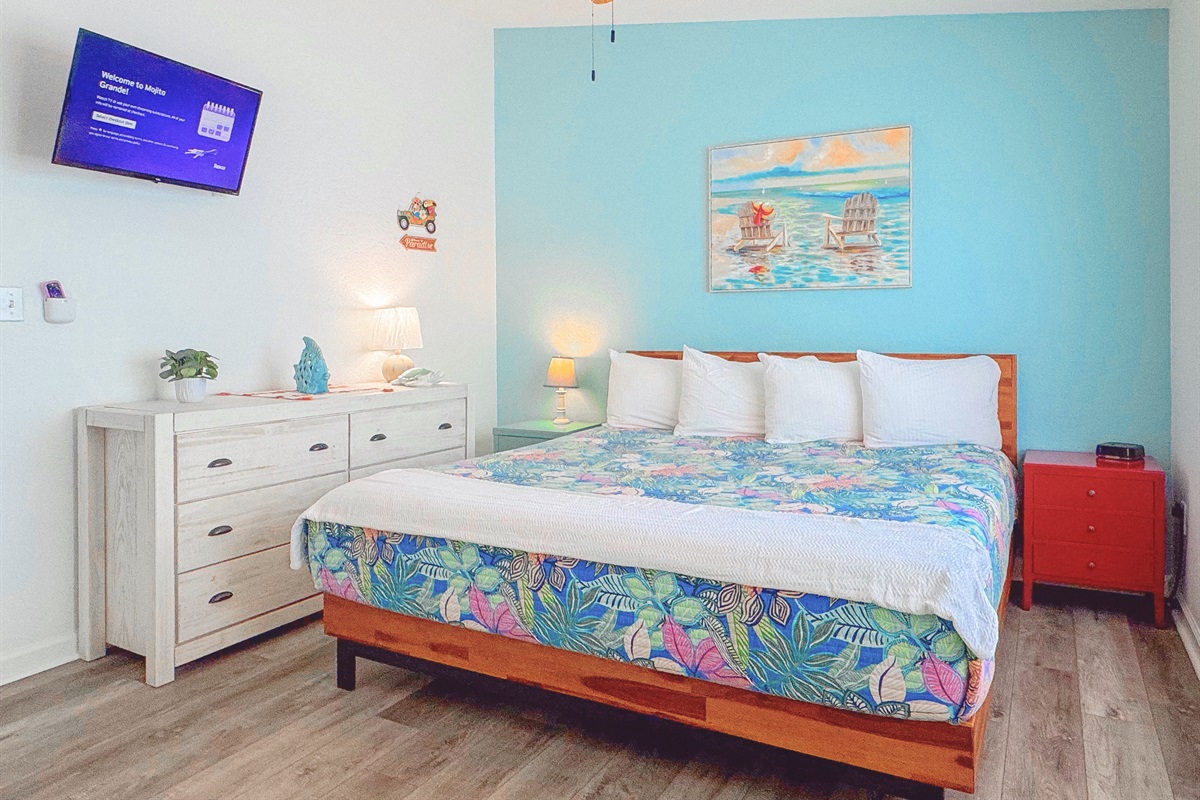 Master bedroom with comfortable king bed.