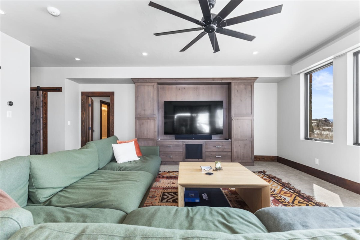 Lower Level Living Room | Ceiling Fan & Smart TV