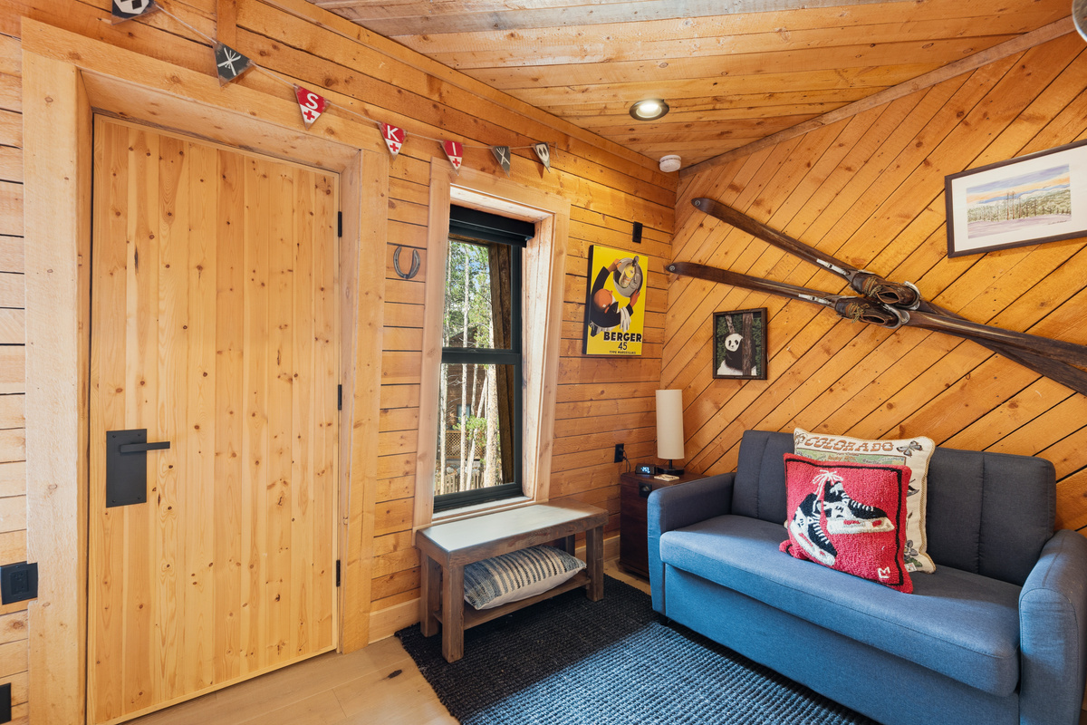 Go to sleep dreaming of the next day on the mountain! This is the twin-over-Queen bunk room with twin sleeper on the upper level. Twin sleeper seen in this photo. Door is a walk-in closet (does not open to a balcony or outdoor space). 