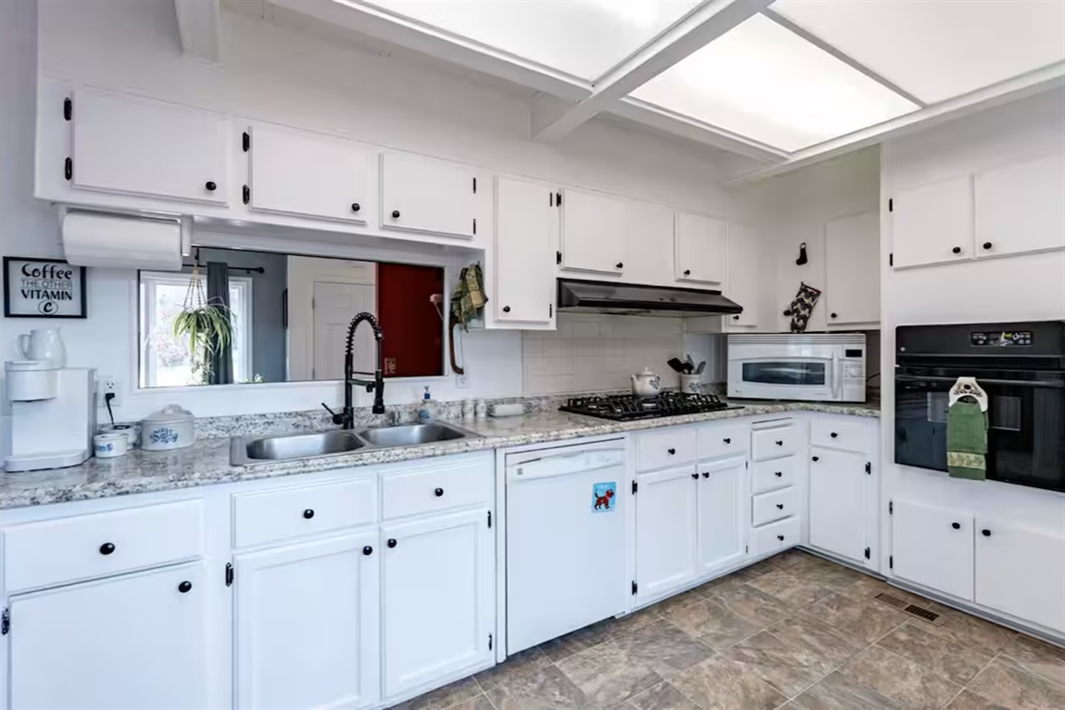 A warmly stocked kitchen inviting you to cook comforting favorite meals.