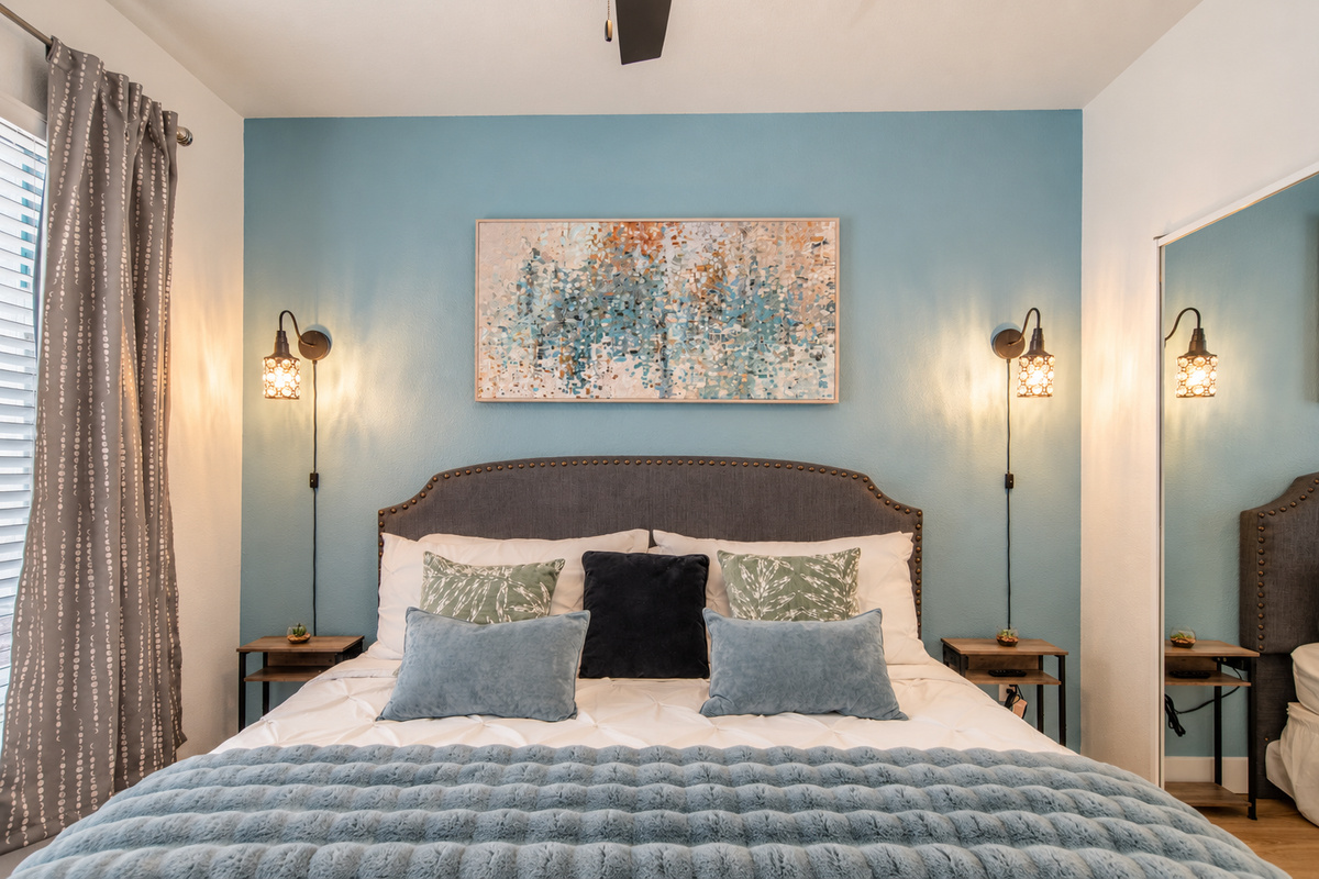 - Sleep soundly in a cozy bedroom featuring soft tones and modern lighting   - Relax under the ceiling fan and unwind after a long day of exploring   - Enjoy a calming space with soothing colors and plush comfort throughout