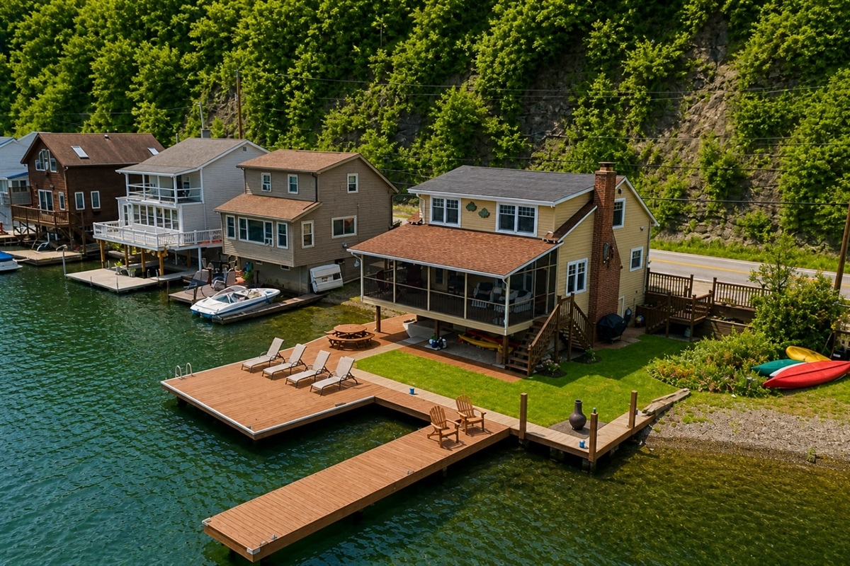 Nestled at the edge of a serene lake, this charming dock features a row of inviting, comfortable chairs, perfect for relaxing and enjoying the peaceful surroundings. The chairs, crafted from weather-resistant materials, are designed for comfort with 