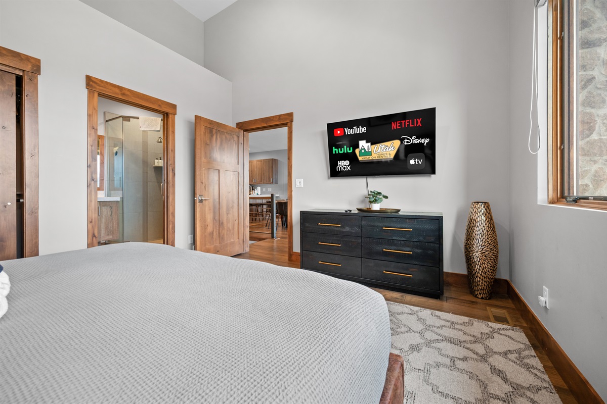 Comfortable bedroom with Smart TV and ample storage
