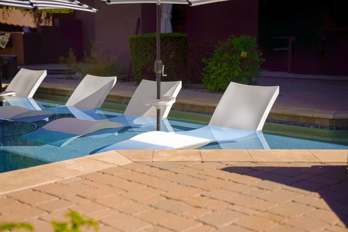 Nothing like laying in the water with a cold drink and watching family or friends splashing around.