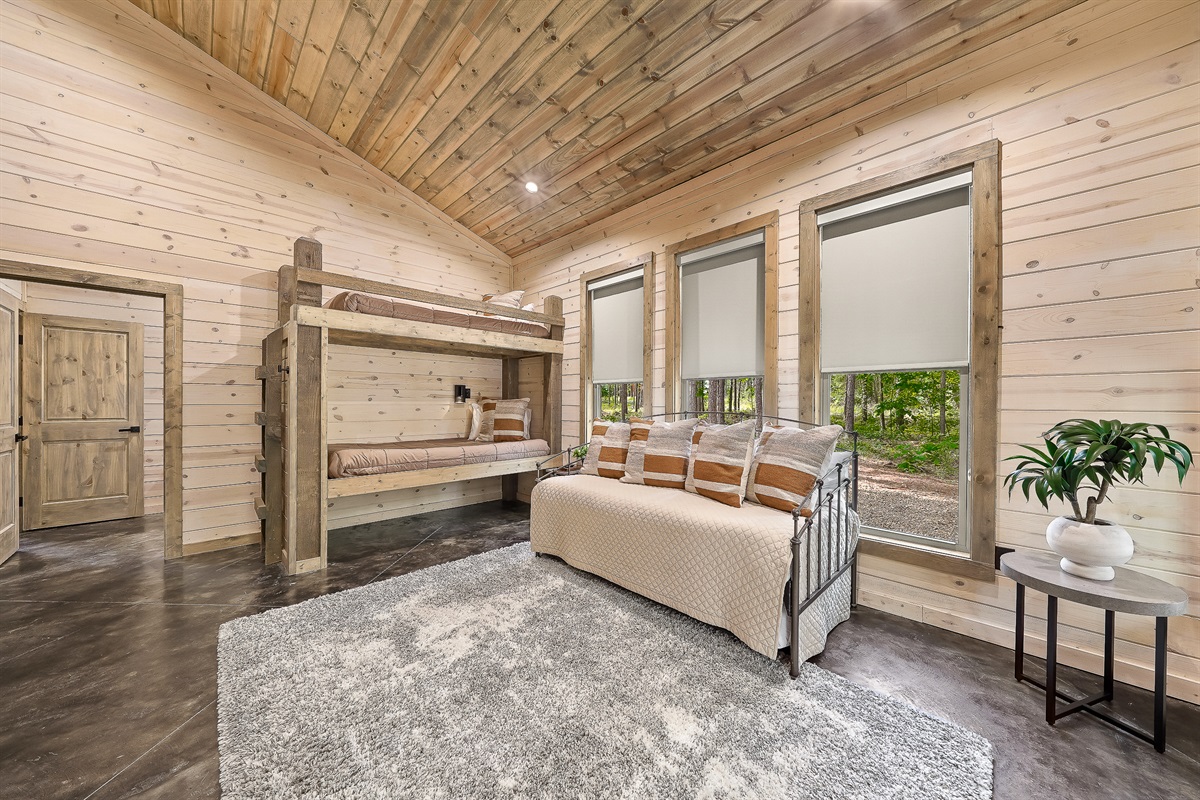 Bedroom 3: Cozy and captivating!  Enjoy the roller shades for a good night&rsquo;s sleep.