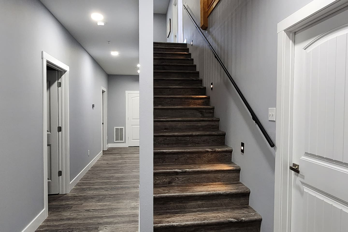 Interior staircase linking shared spaces and sleeping areas.