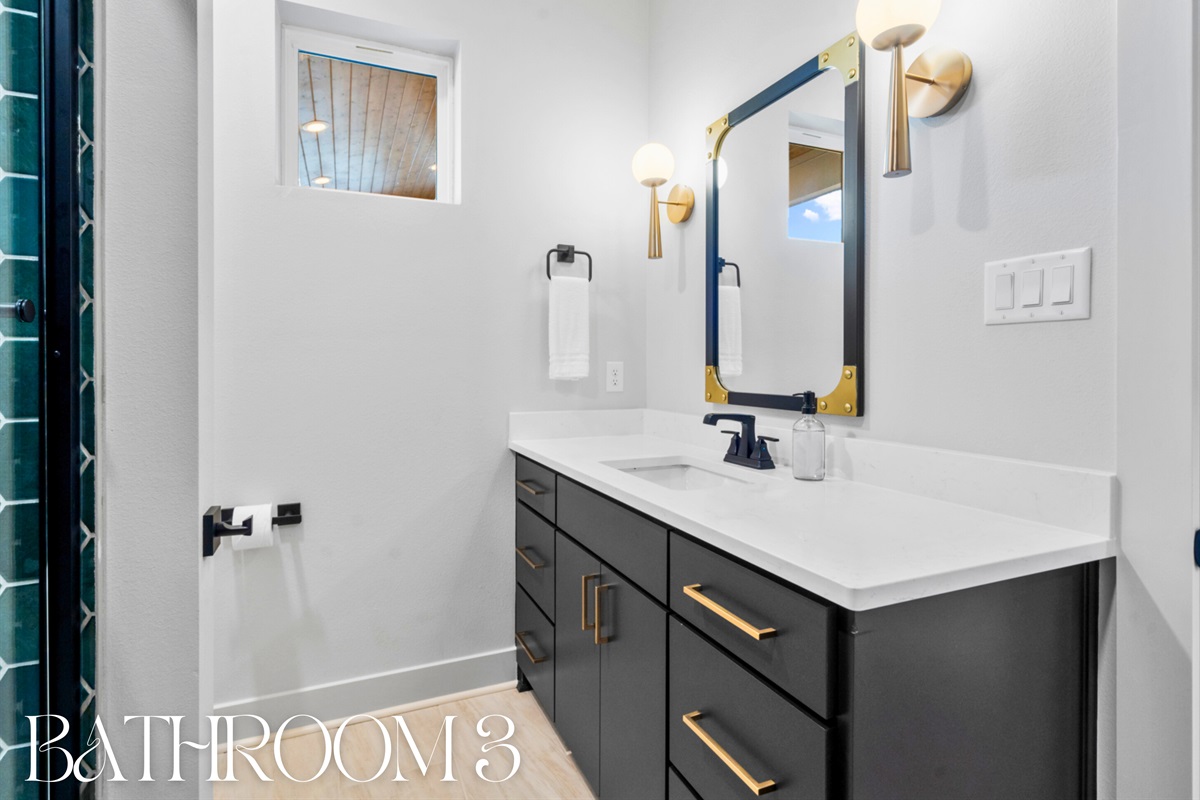 Elegant bathroom with a large vanity and modern fixtures &ndash; a touch of luxury and convenience.