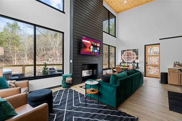 Living Room: Bright and airy space featuring plush seating and stunning nature views!