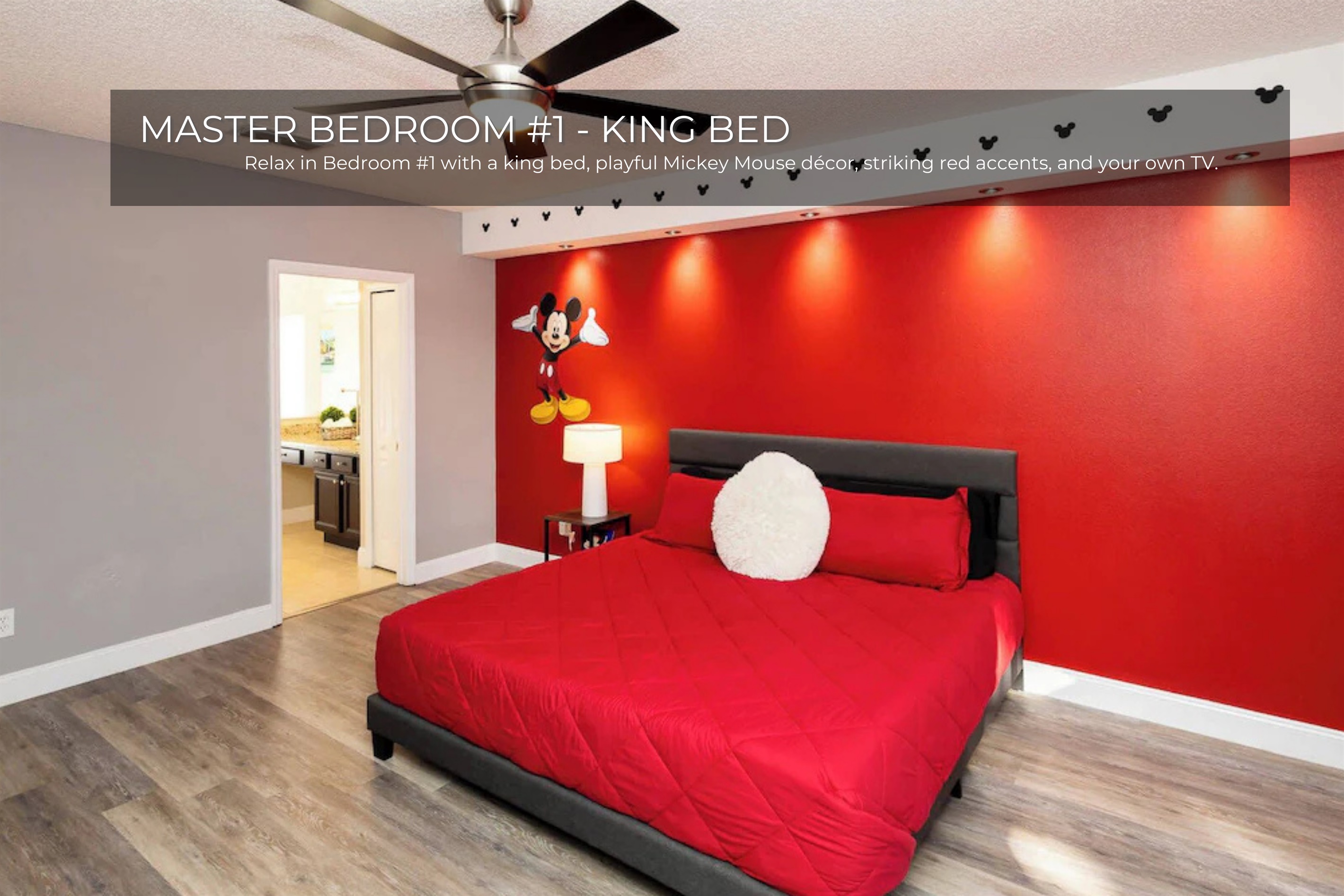 Fun meets comfort—Bedroom 1 features a red Mickey Mouse theme with a soft king bed.