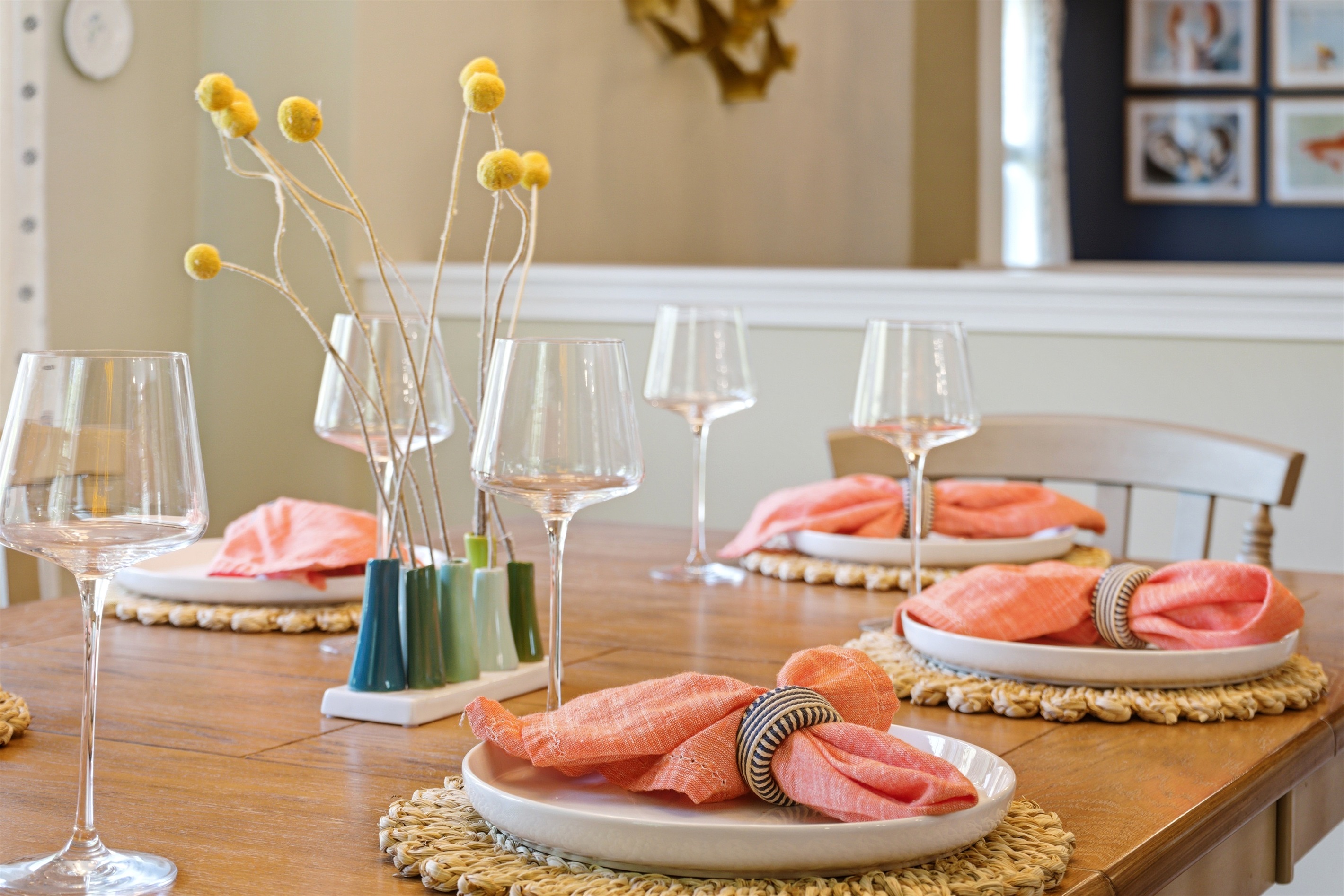 A beautifully set table accented with wine glasses, creating a cozy and refined atmosphere for dining and conversation.