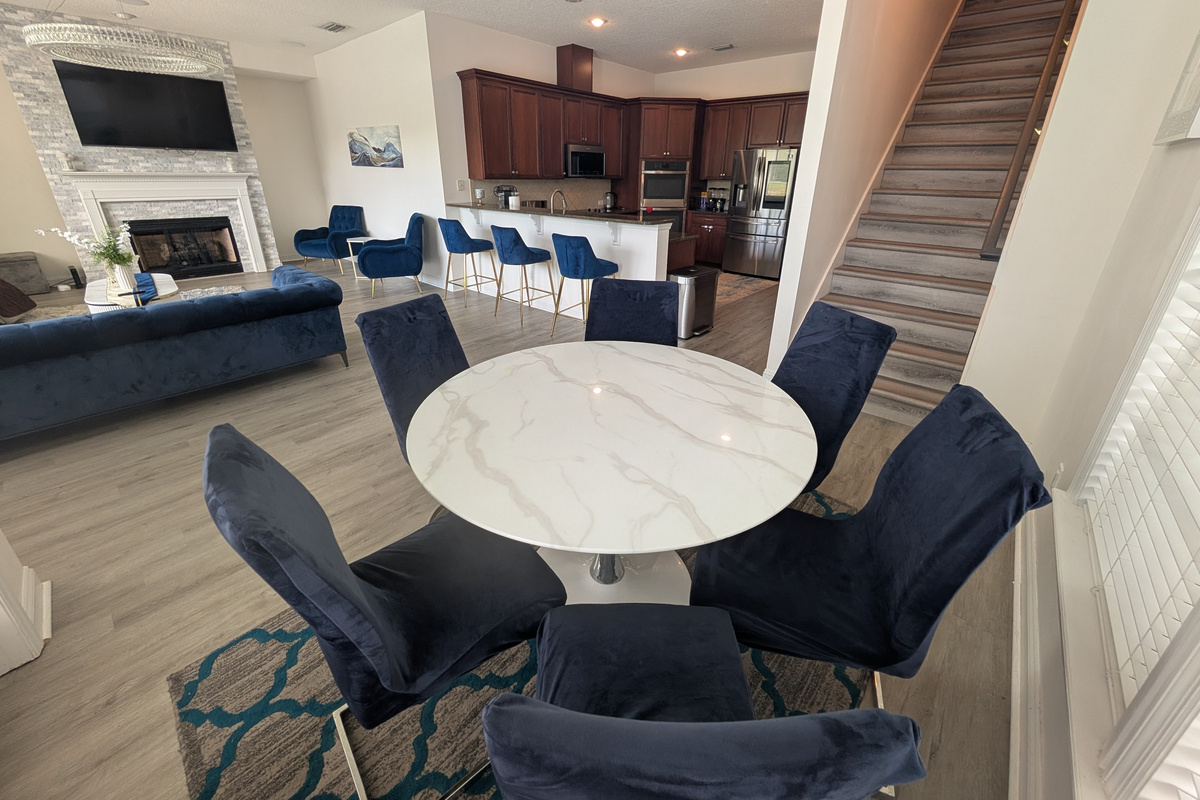 Casual dining area for six with an open view into the kitchen and living room.
