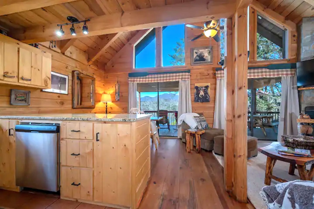 Open living room/ kitchen with wrap around, fully enclosed decks. Beautiful mountain/lake views.