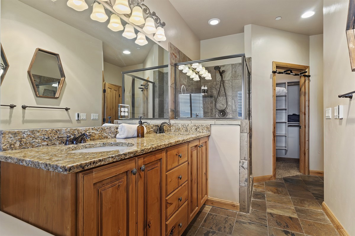 Spacious primary bathroom with double vanity, soaking tub, and walk-in shower.