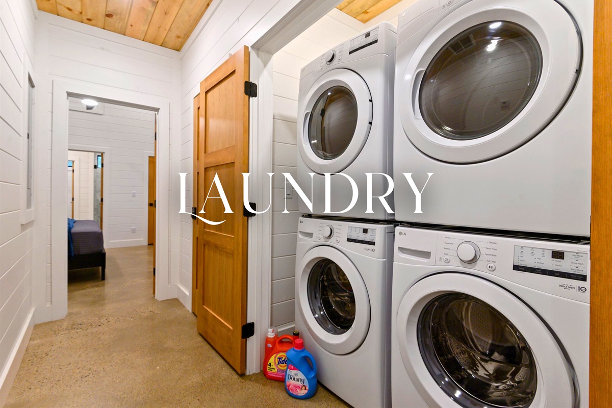 Keep everything fresh during your stay with this full-sized washer and dryer setup, tucked neatly off the main hallway.