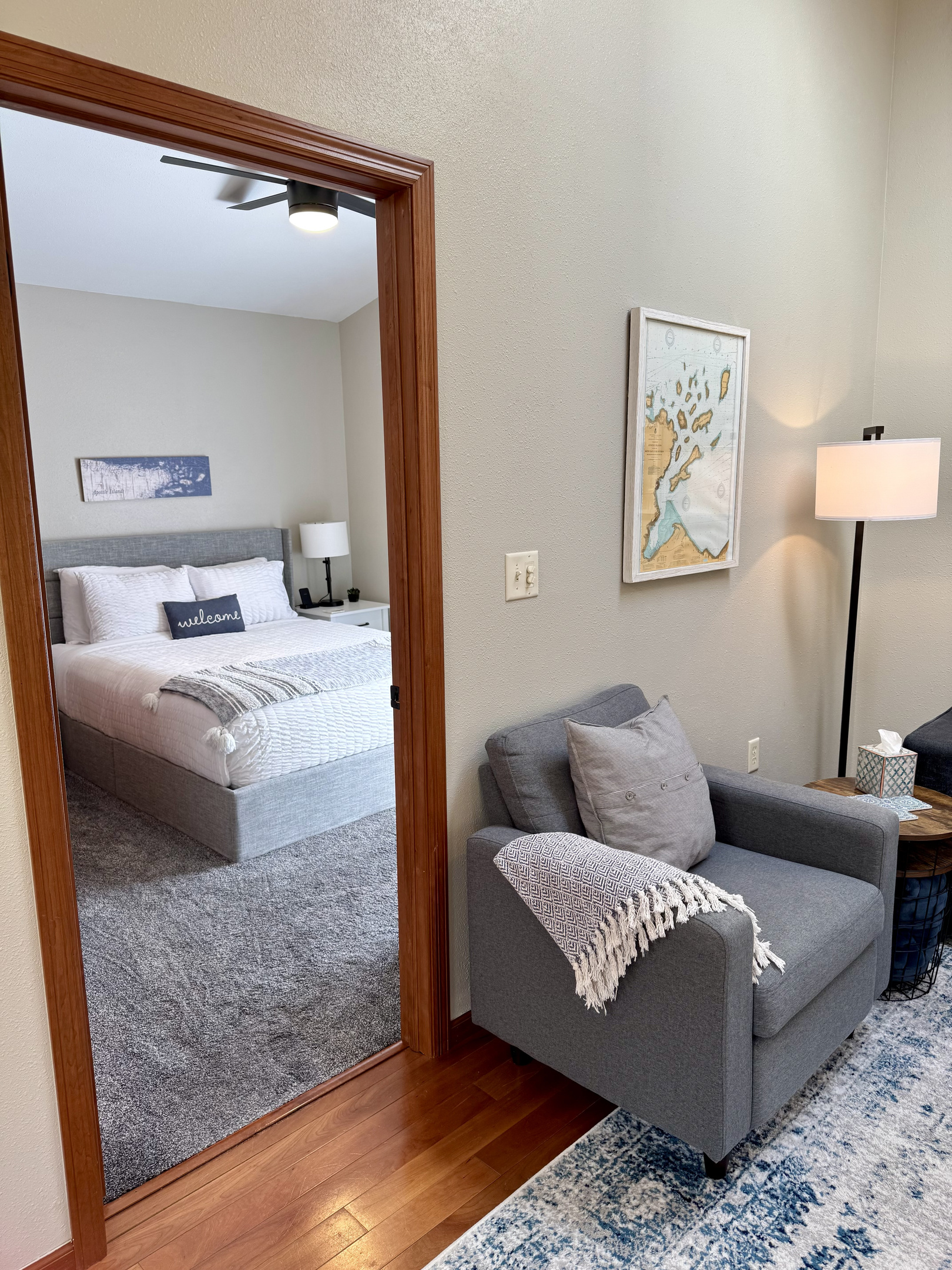 Main cottage living room leading to queen bedroom 