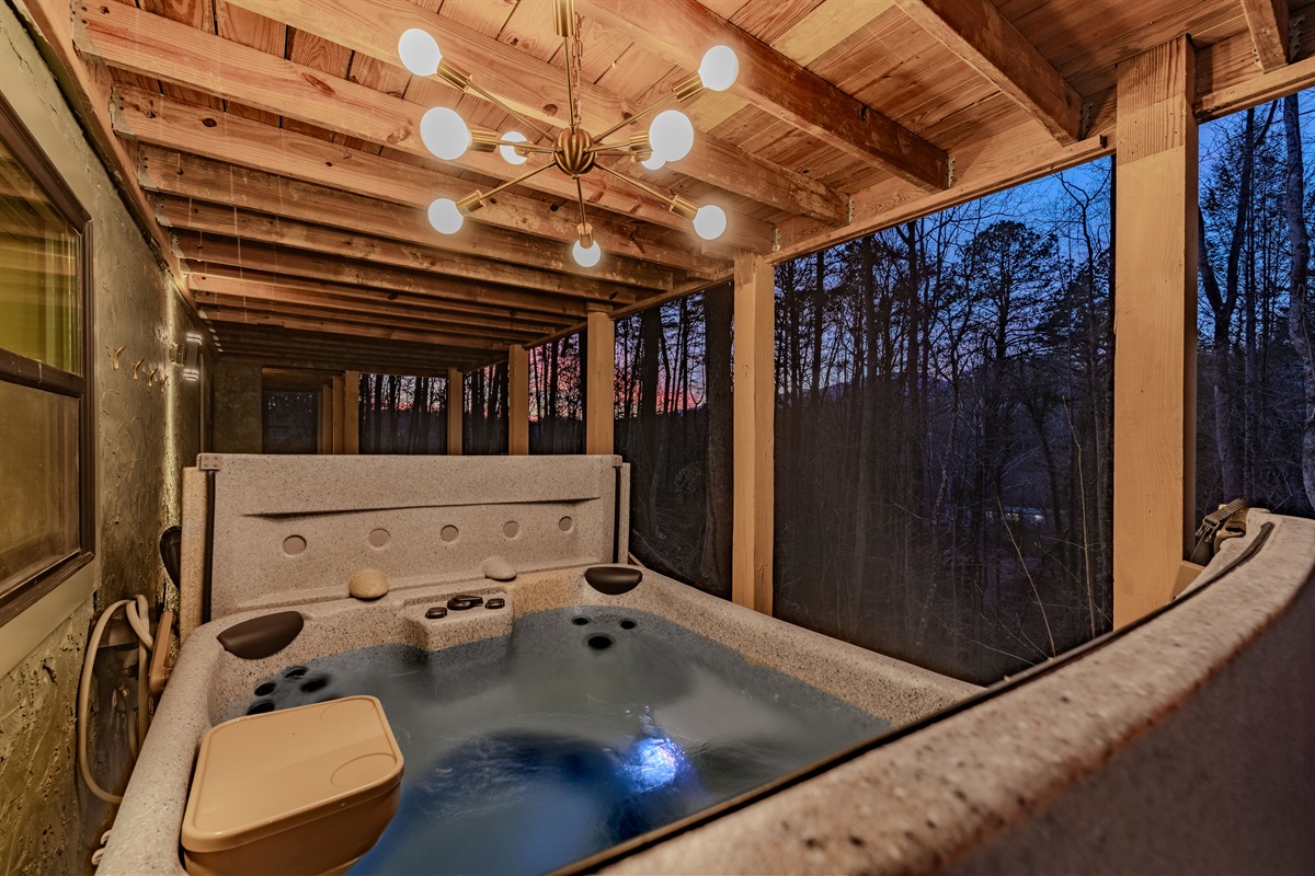 Spa time with a view. The hot tub is complemented by extra lounge seating and ambient lighting for a perfect evening.