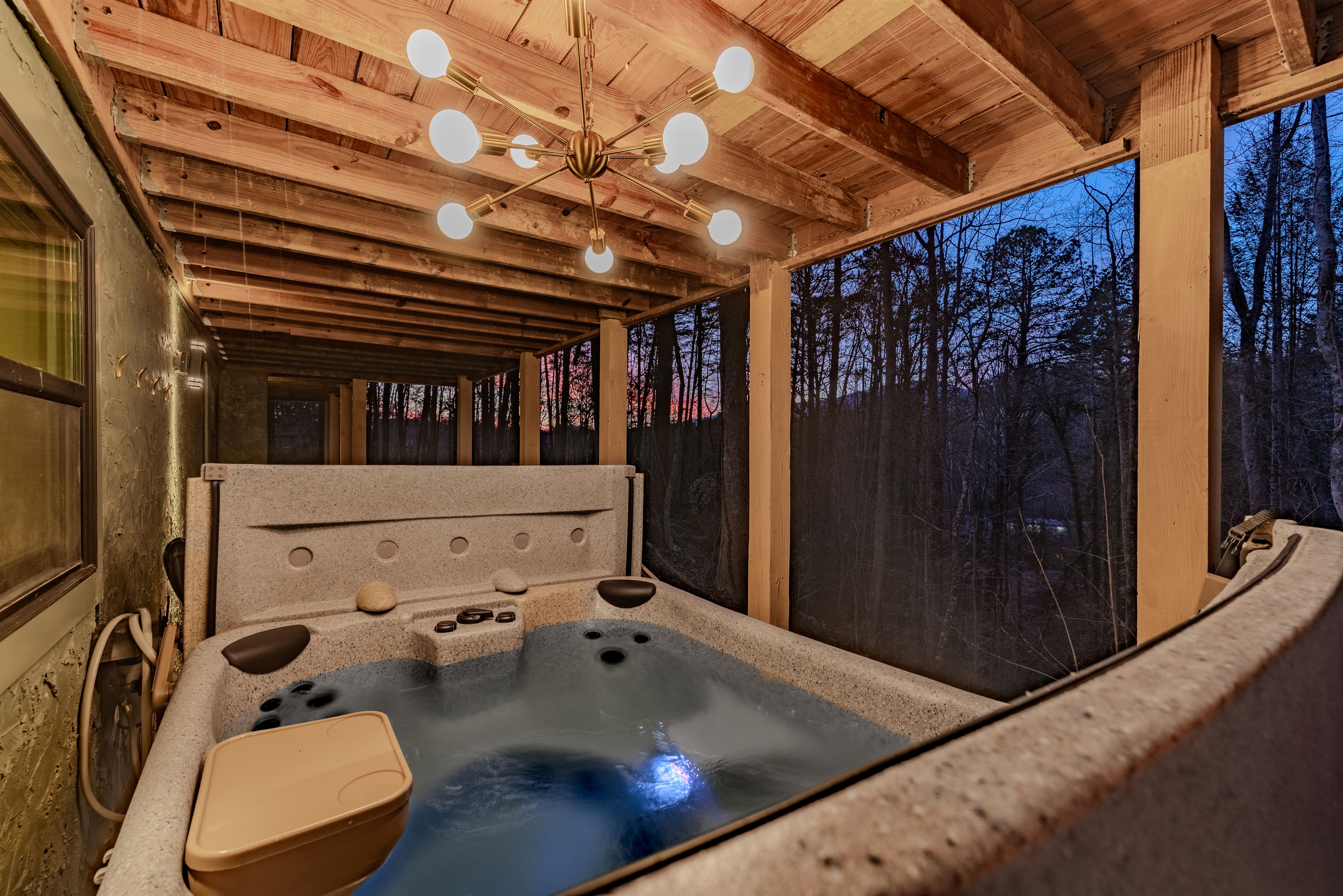Spa time with a view. The hot tub is complemented by extra lounge seating and ambient lighting for a perfect evening.