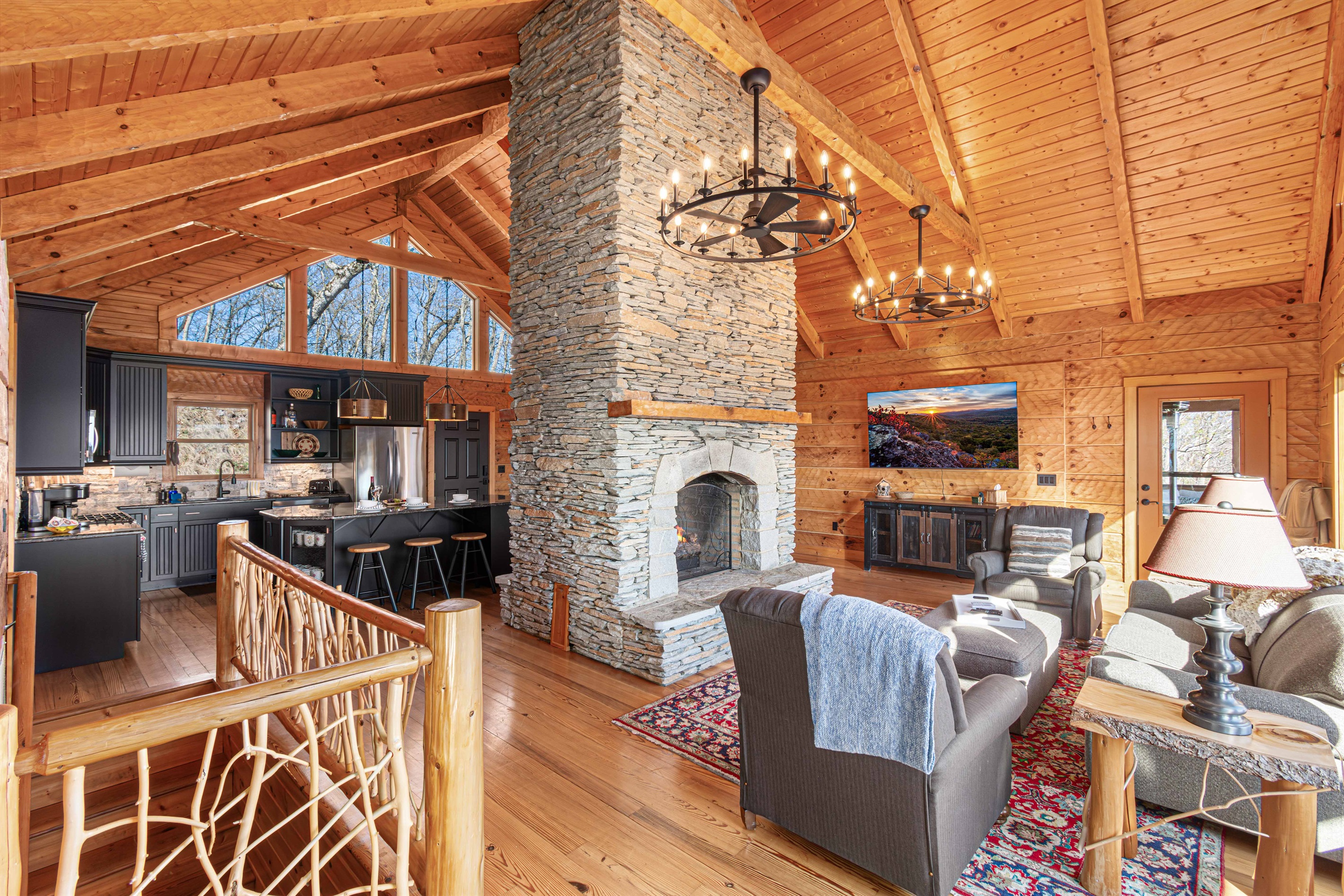 Living Room: Revel in stunning views and a charming stone fireplace in stylish comfort!