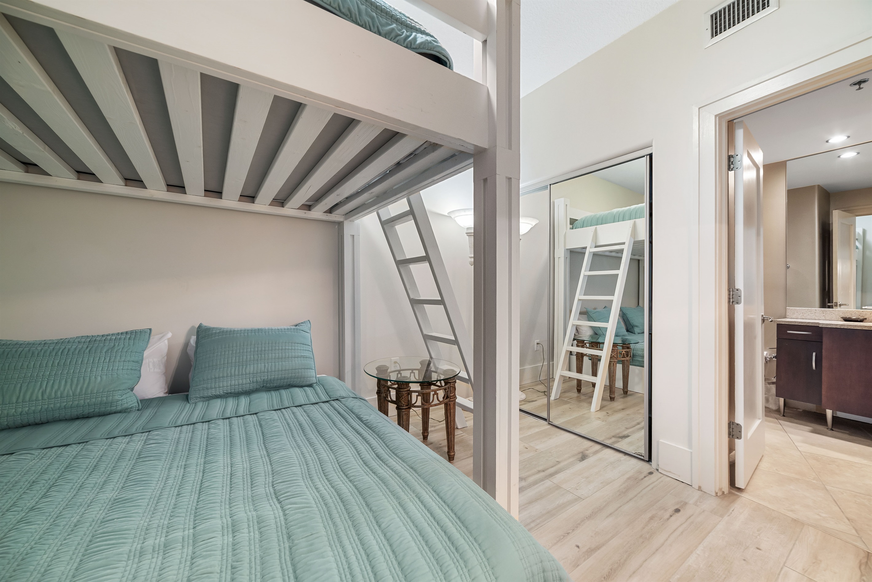 Maximize your space with these cozy built-in bunk beds, providing extra sleeping arrangements for your guests.