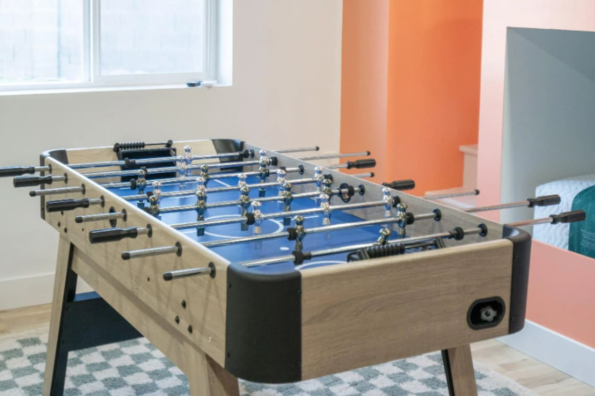 Balls racked and cues ready, this table is set for a friendly night of pool.
