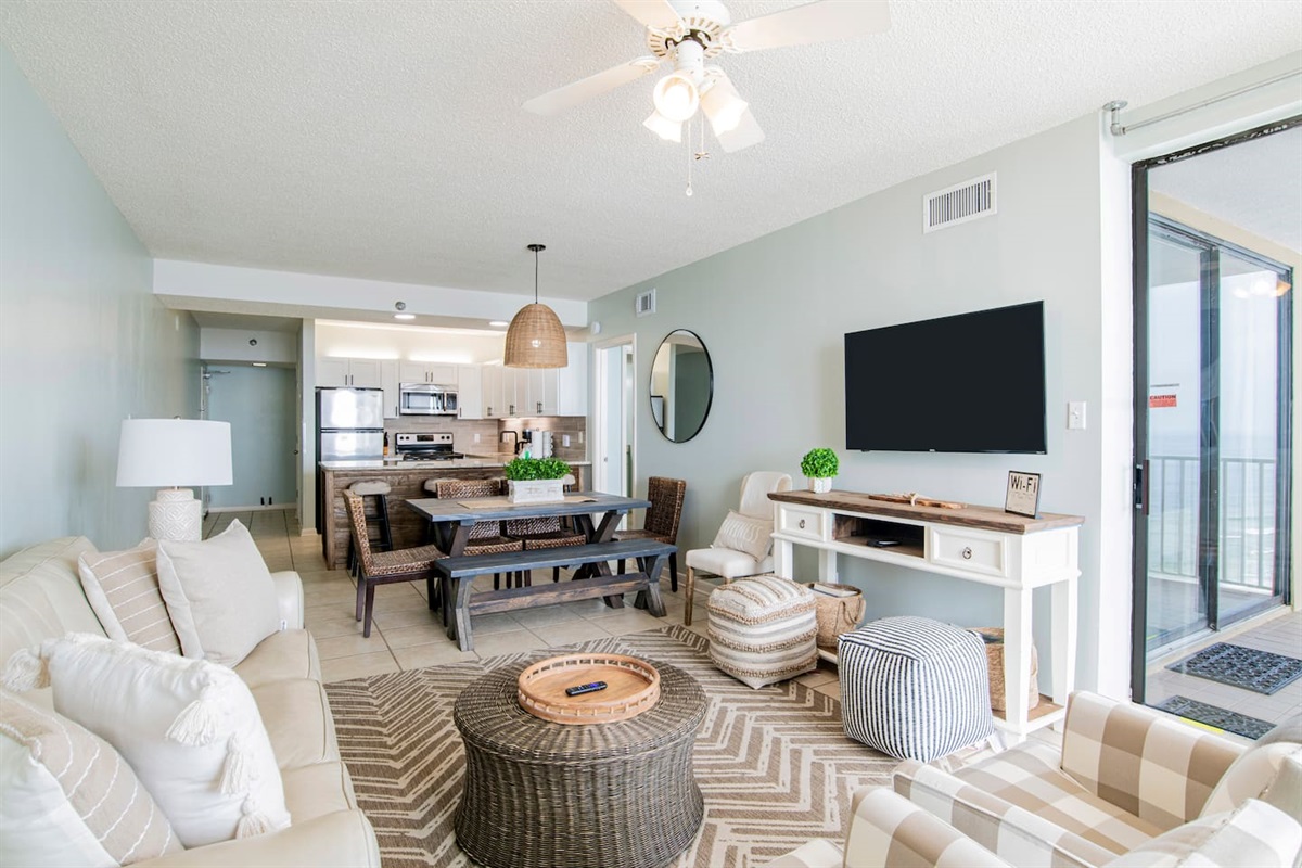 Comfie couch and chairs to unwind after a day in the sun, with a 50" smart TV and plenty of seating for lunch or dinner at the solid wood table, too.