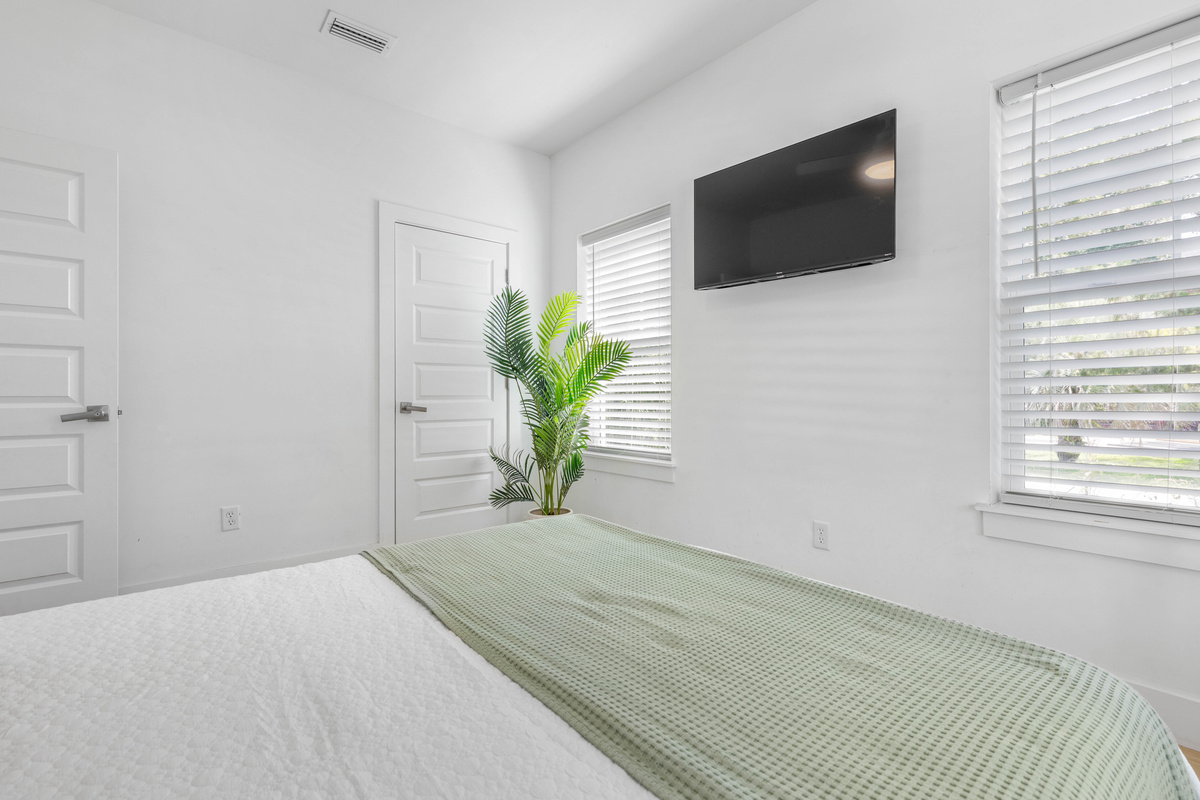 A closet with real hanging space, which matters when a family unpacks for a week rather than a weekend. The television is set for the end of the day, when everyone retreats to their own corner of the house.