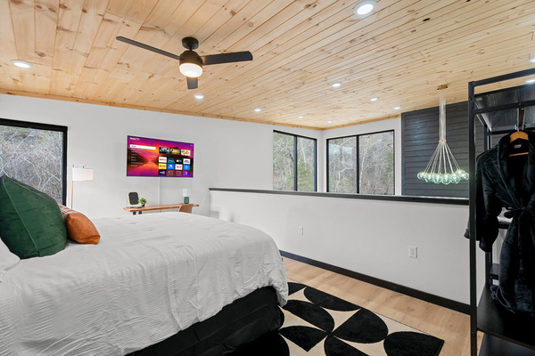 Relax in style with panoramic views and modern decor, perfect for unwinding! Note that this bedroom is lofted and open to the living area below. The entire loft is dedicated to this space with ensuite bathroom.