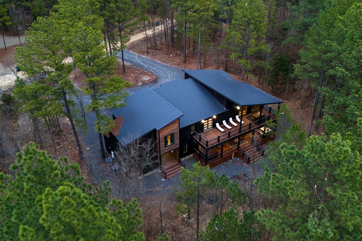 Nestled among the trees, this luxurious retreat offers seclusion, serenity, and plenty of room to explore.