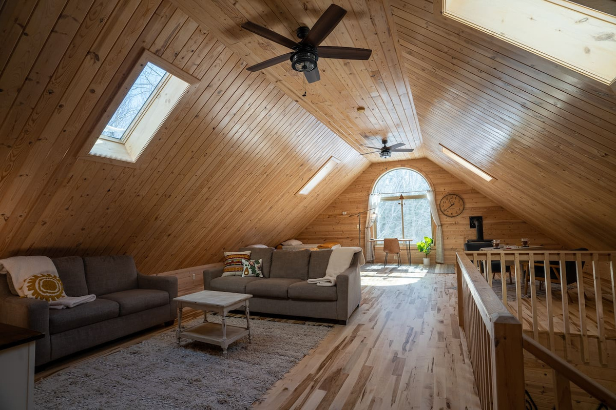 The upstairs living room is perfect in every way.  So much natural light coming in from the large end window and sky lights.  This space is HUGE from its soaring ceilings and open layout.  