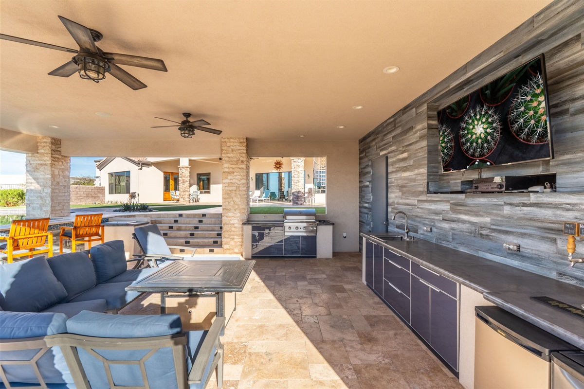 Experience true resort-style living in your private backyard oasis, complete with a sparkling pool, relaxing spa, shaded gazebo, grill station, and inviting outdoor lounge perfect for sunset dinners and laid-back gatherings.