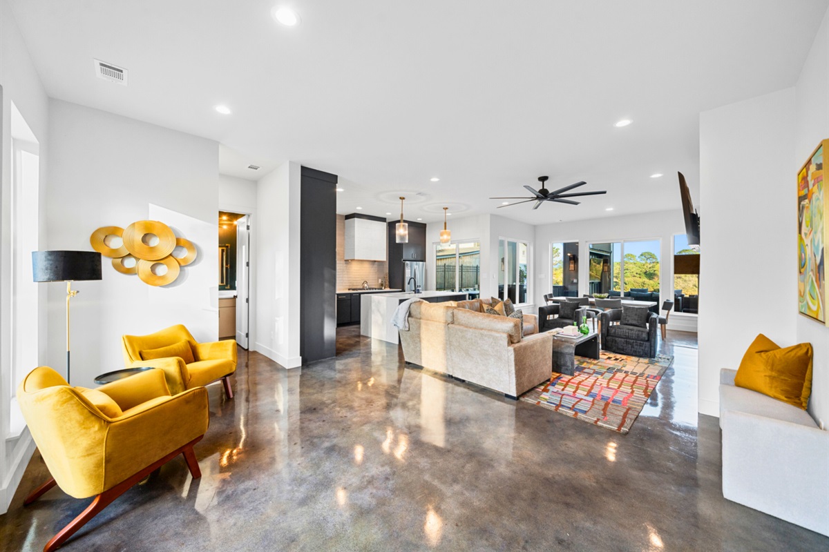 This open and welcoming space flows naturally, with cozy corners and plenty of room for everyone to enjoy and unwind.