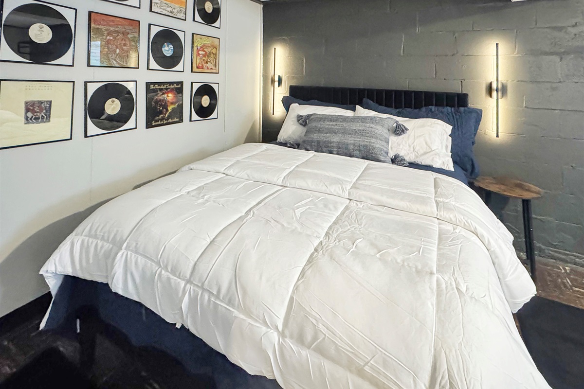 Spacious lower level bedroom with dual queens and premium bedding.