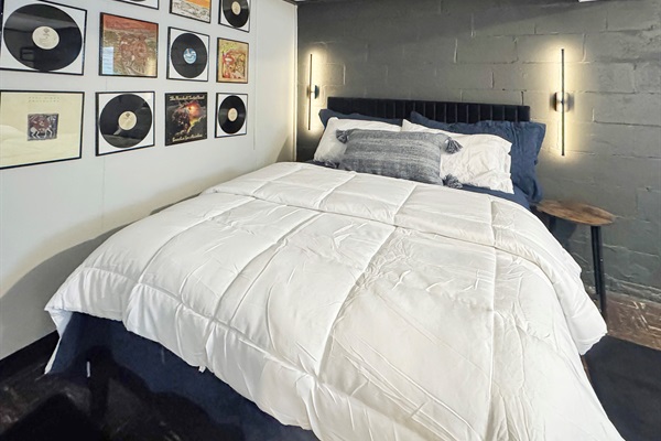 Spacious lower level bedroom with dual queens and premium bedding.