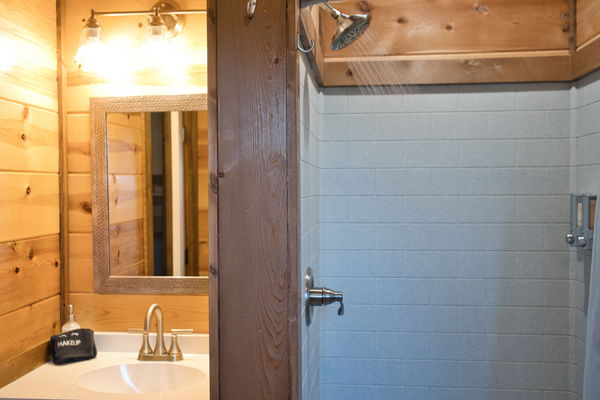 Bunk room’s ensuite private full bathroom with stand up shower—perfect for guests or kids.