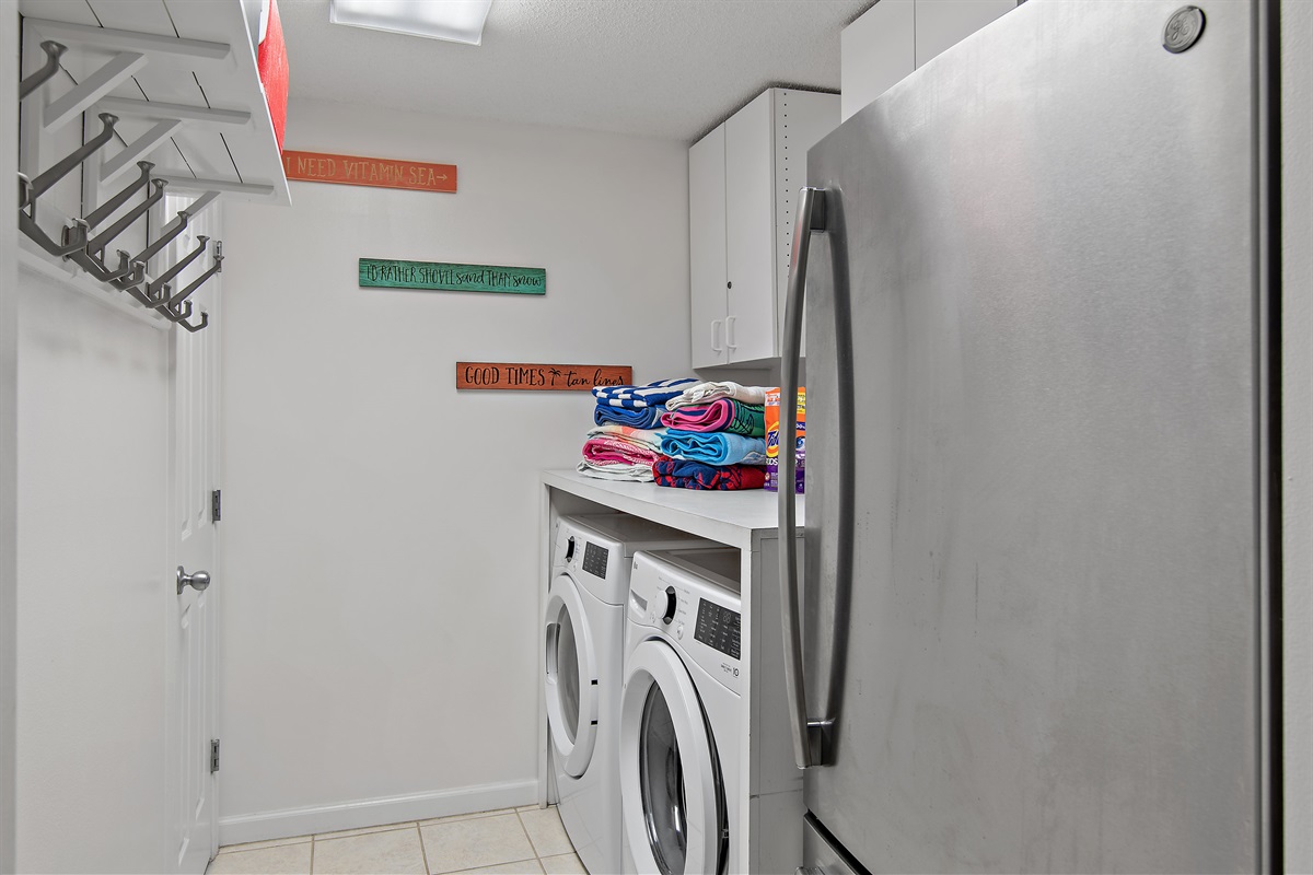 Full size washer and dryer and plenty of Tide Pods and Bounce sheets for your whole visit + an EXTRA Refrigerator!