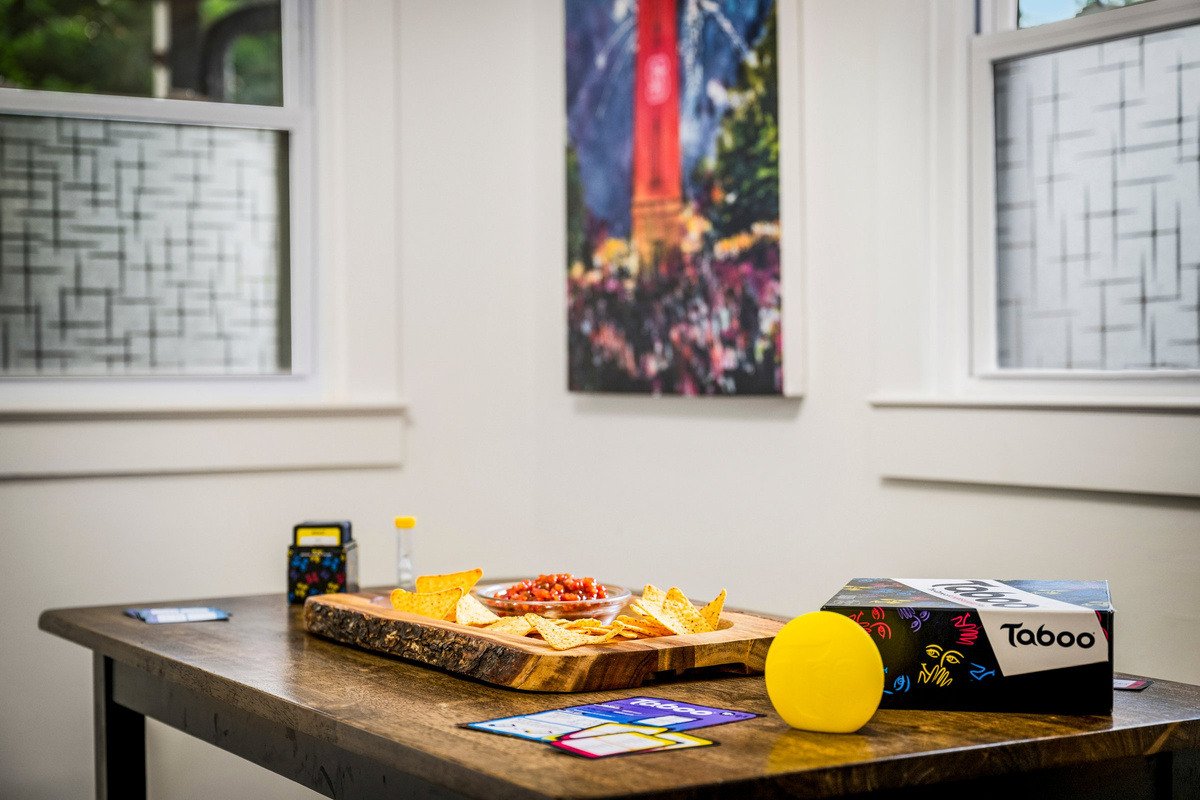 Local artwork and Wolfpack touches can be found throughout the cottage.