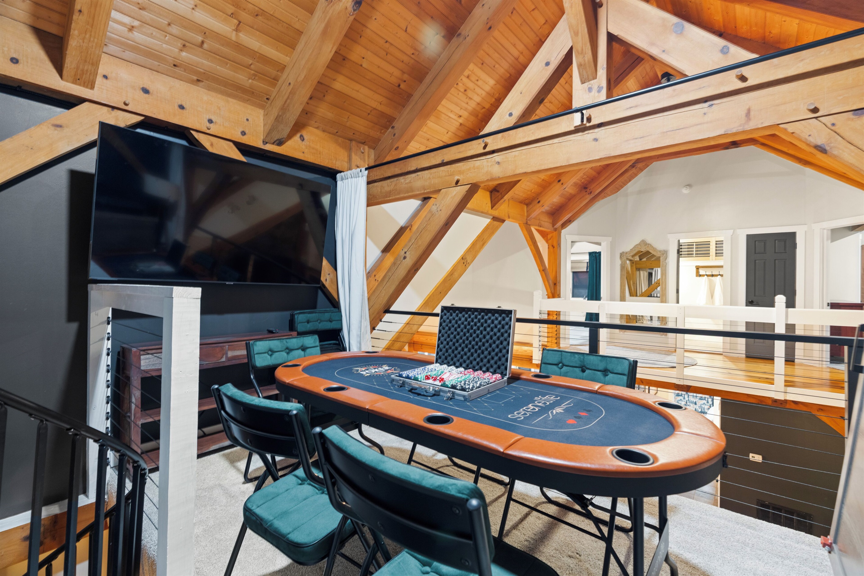 BR8: when murphy bed folds closed, loft area transforms to a poker area