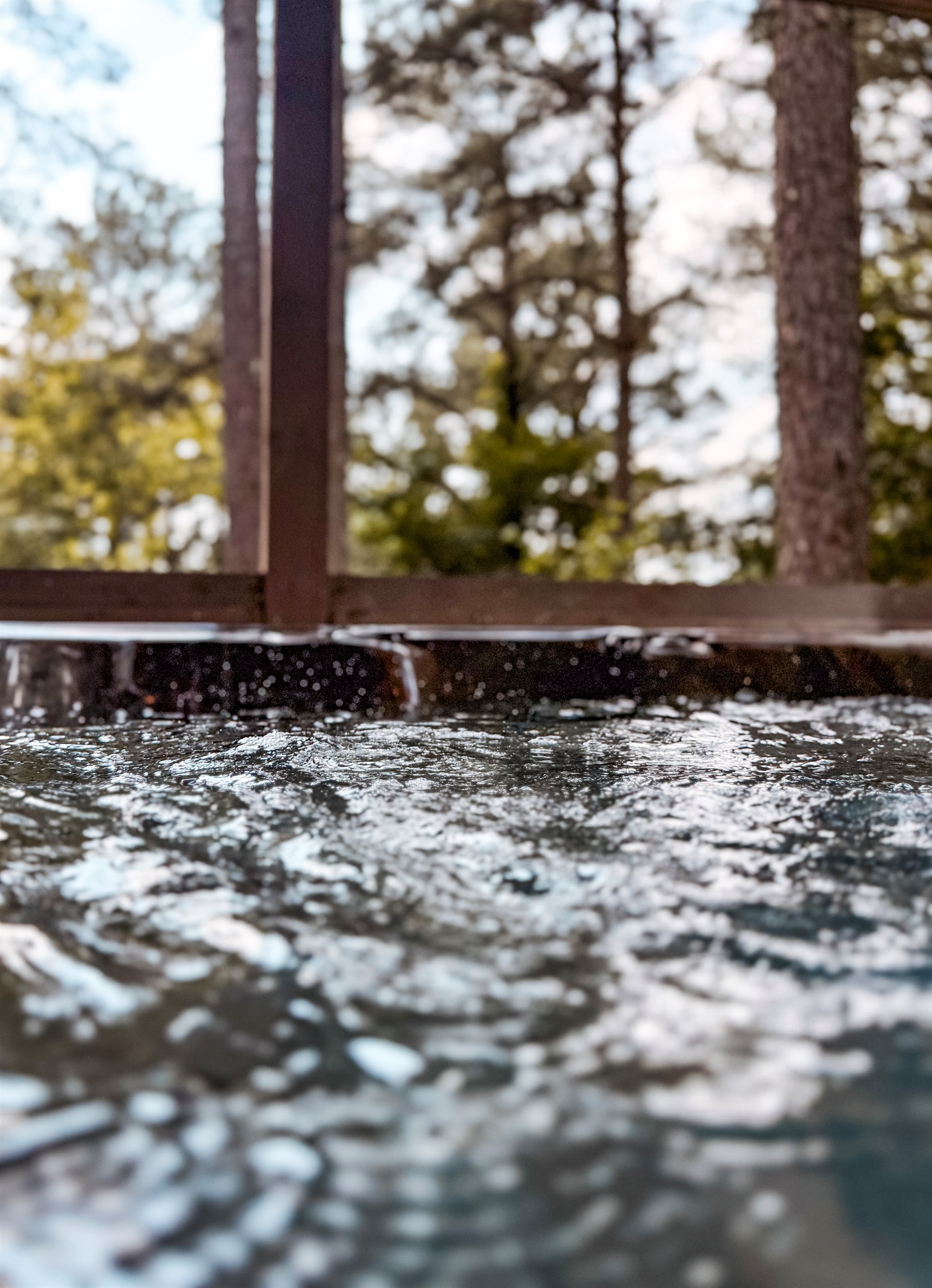 The hot tub makes evenings at The Americana feel like a private spa in the forest.