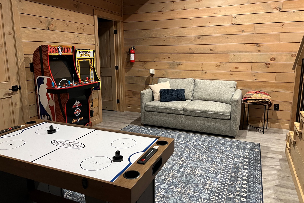 Updated game room with 2 arcades and a game table with air hockey/foosball
