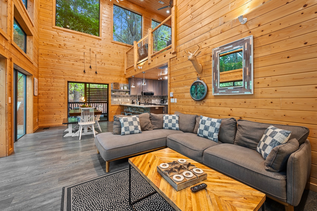 The open-concept design continues into another seating area, giving everyone plenty of room to spread out while still feeling connected.