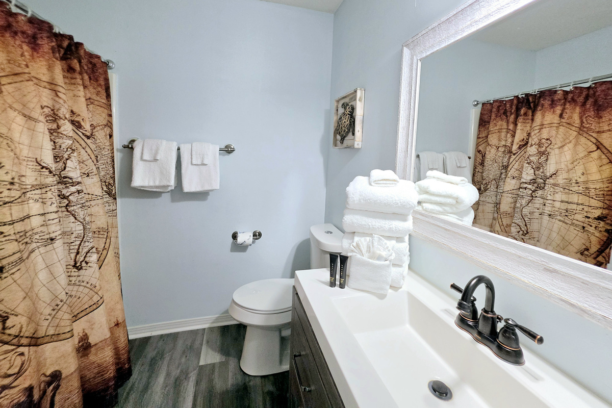 Bathroom vanity stocked with fresh towels