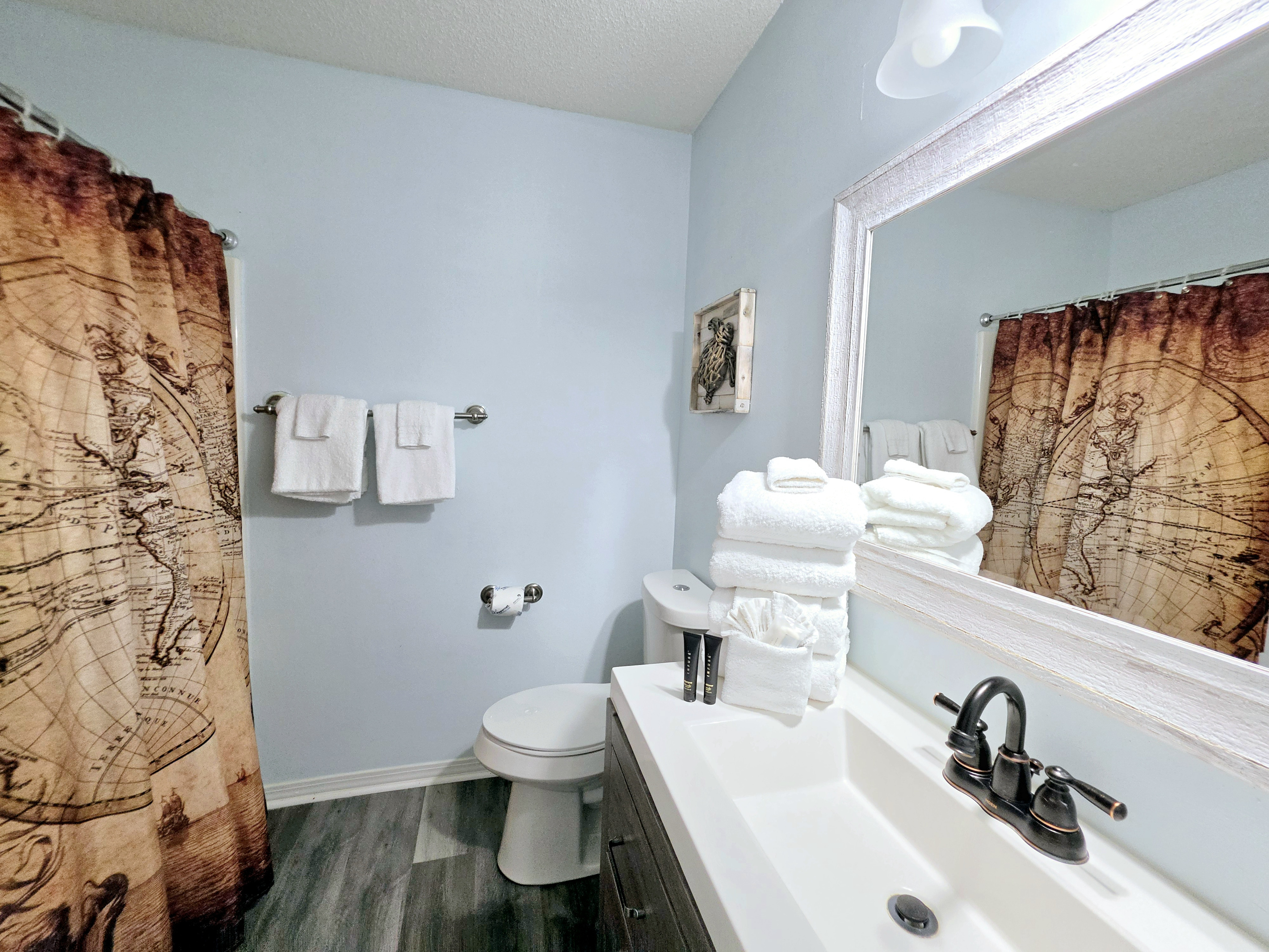 Bathroom vanity stocked with fresh towels