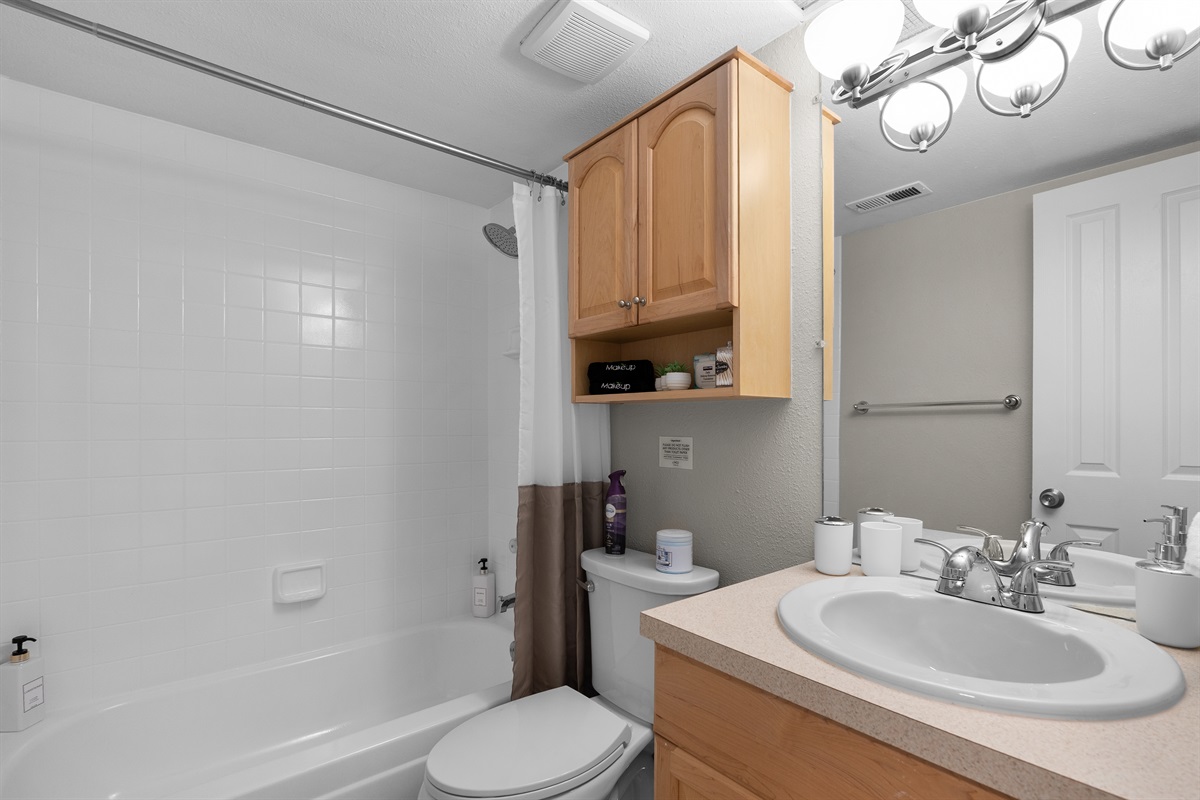 Full Bathroom located in hallway.