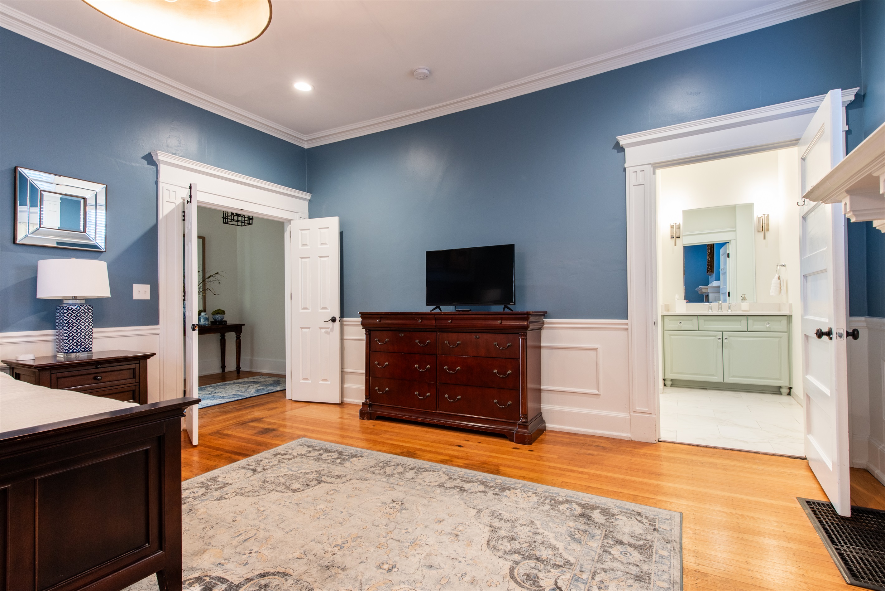 Primary Bedroom ~ 1st Floor ~ King Size Bed ~ Attached Renovated Full Bath ~ Walk in Closet ~ 50" Smart TV ~ Single Pull Out Sofa
