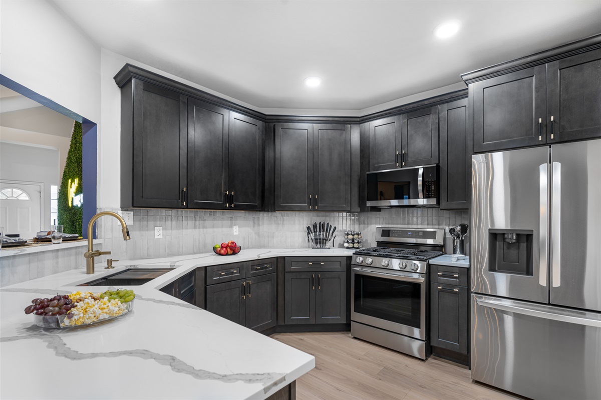 Welcome to your culinary playground! With a built-in air fryer in the oven plus essential cookware, dinnerware, and a selection of spices, this space is ready to inspire your inner chef!