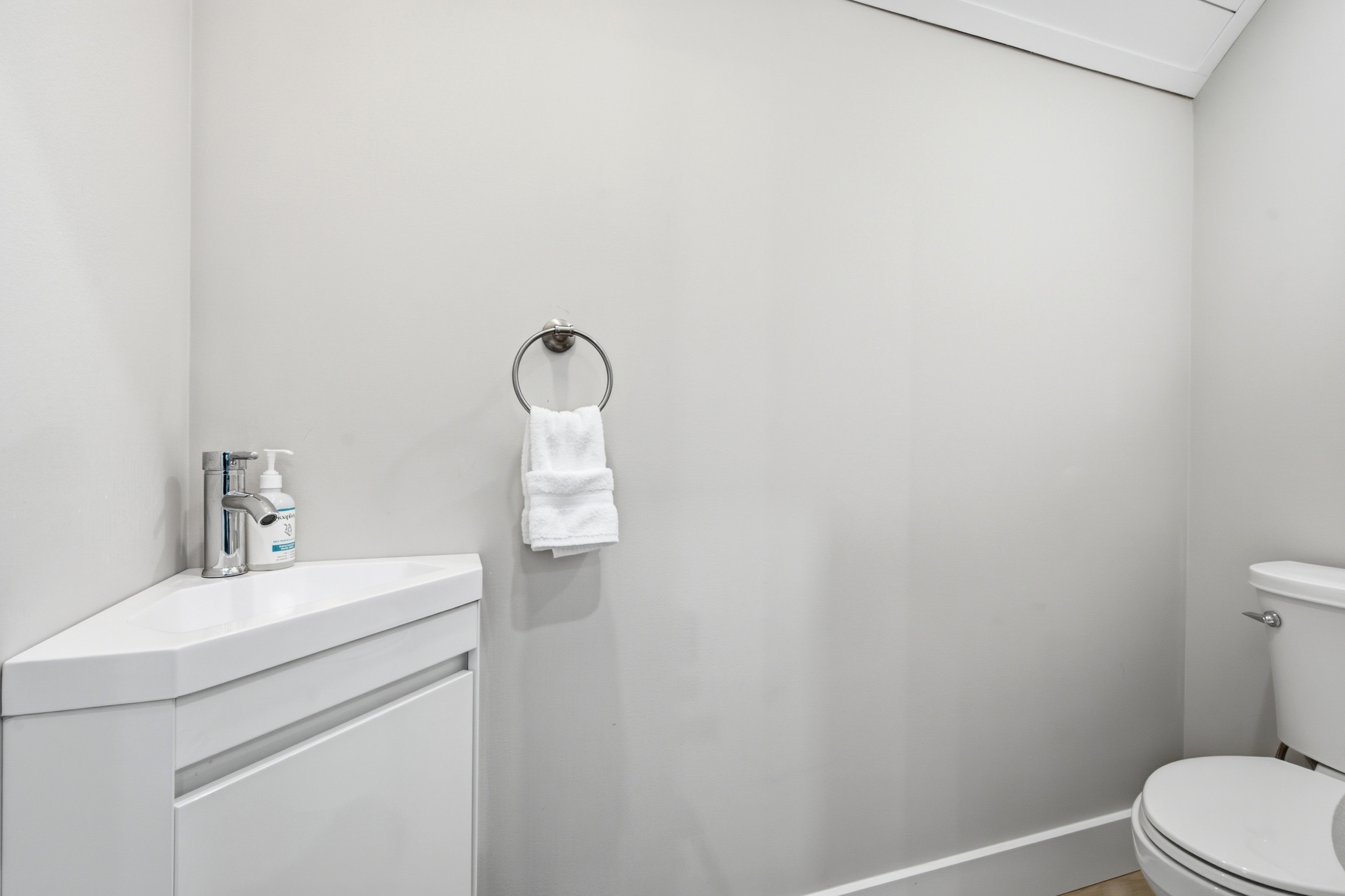 Clean, simple finishes create a fresh and convenient space for getting ready.