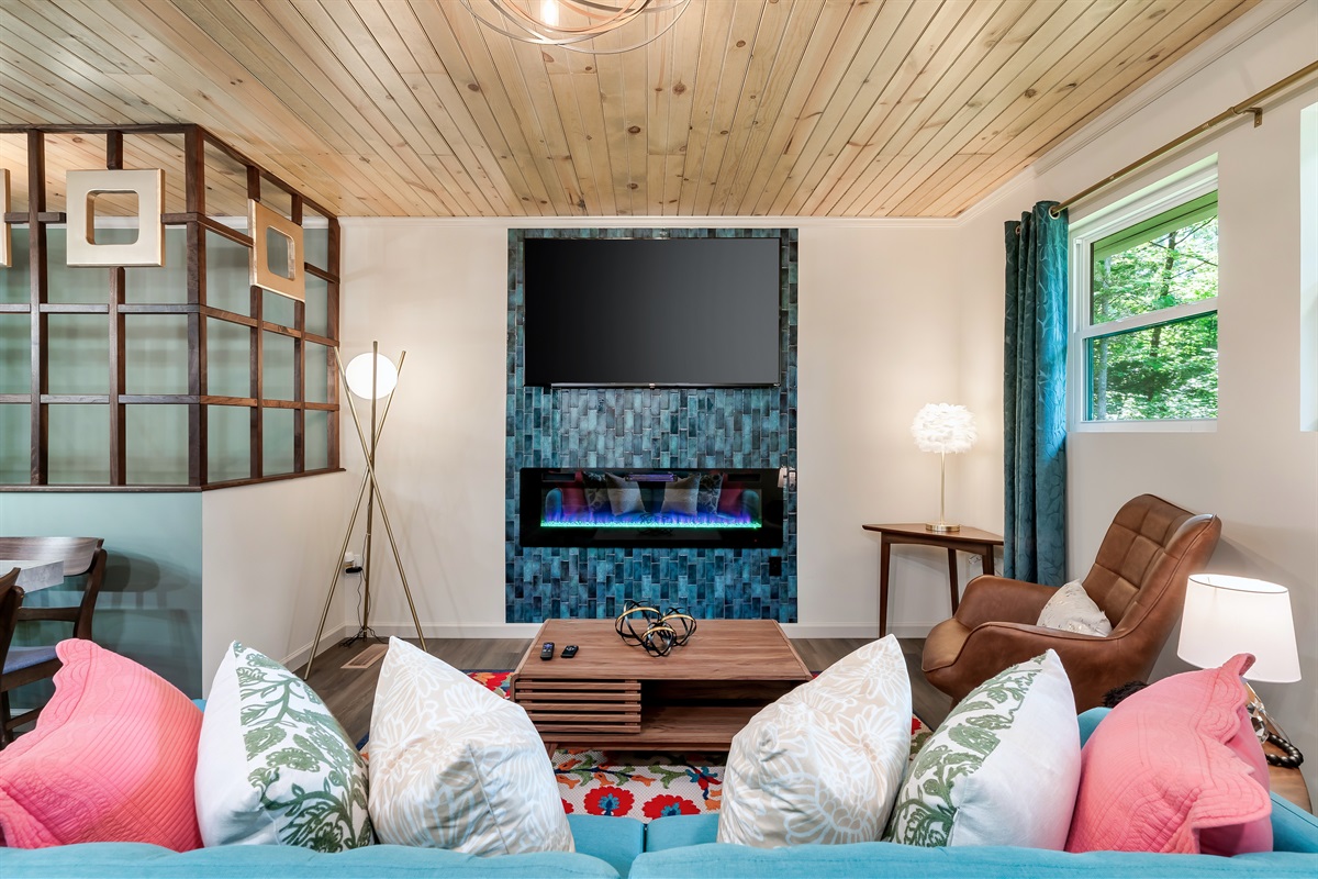 The perfect blend of color and texture. From the unique tile and rug to the wood ceiling, this is a truly memorable space.