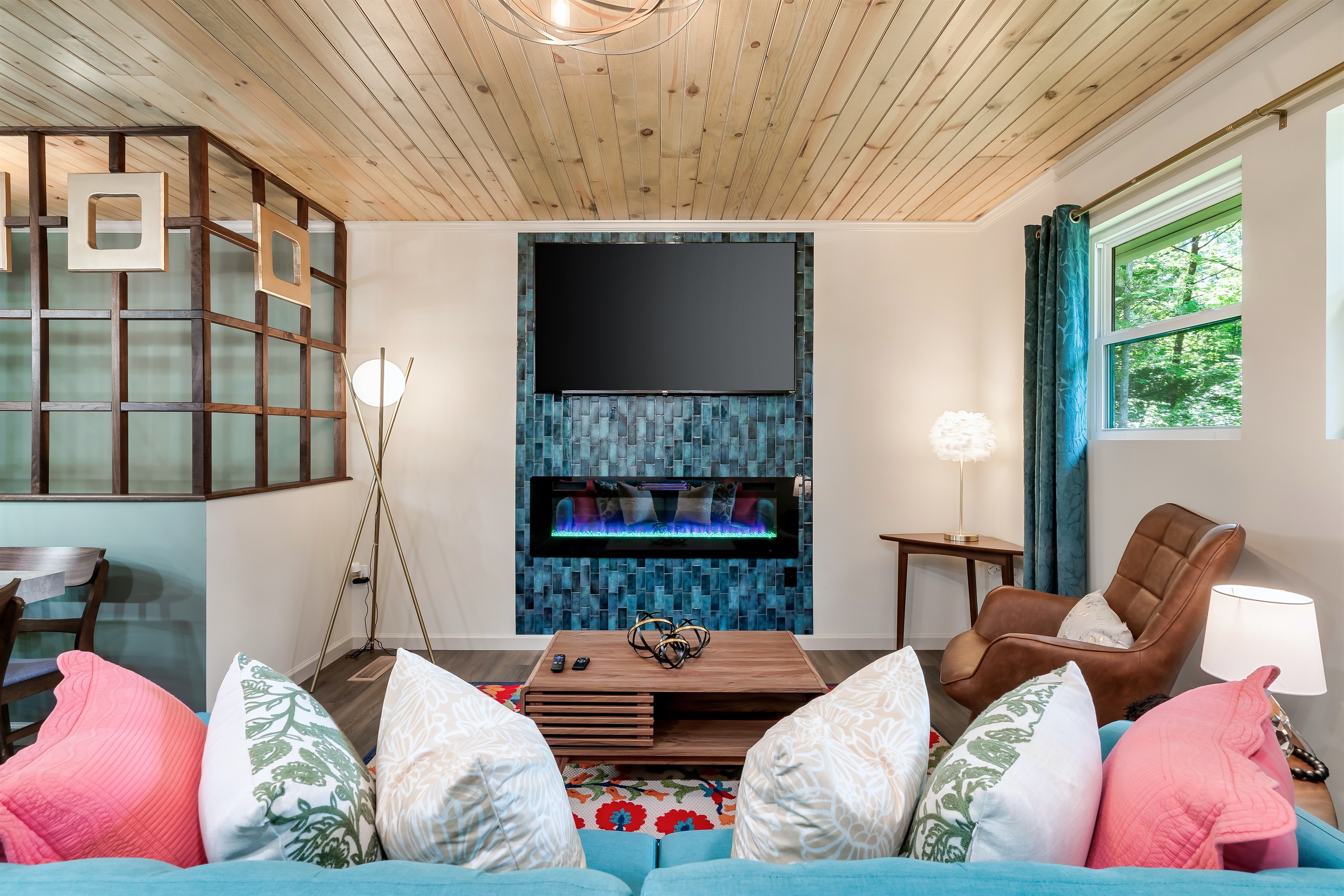 The perfect blend of color and texture. From the unique tile and rug to the wood ceiling, this is a truly memorable space.