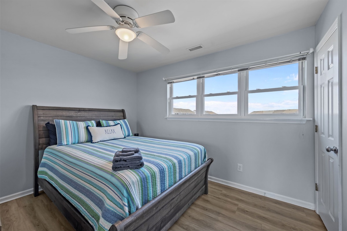 Second bedroom with Queen bed and bright windows